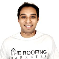 Founder of The Roofing Marketer wearing a branded white hoodie